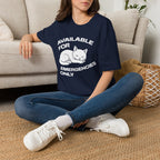 T-Shirt — 'AVAILABLE FOR EMERGENCIES ONLY' Tired Cat Graphic Tee (Tired jokes)