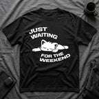 T-Shirt — 'JUST WAITING FOR THE WEEKEND' Tired Cat Graphic Tee (Tired jokes)