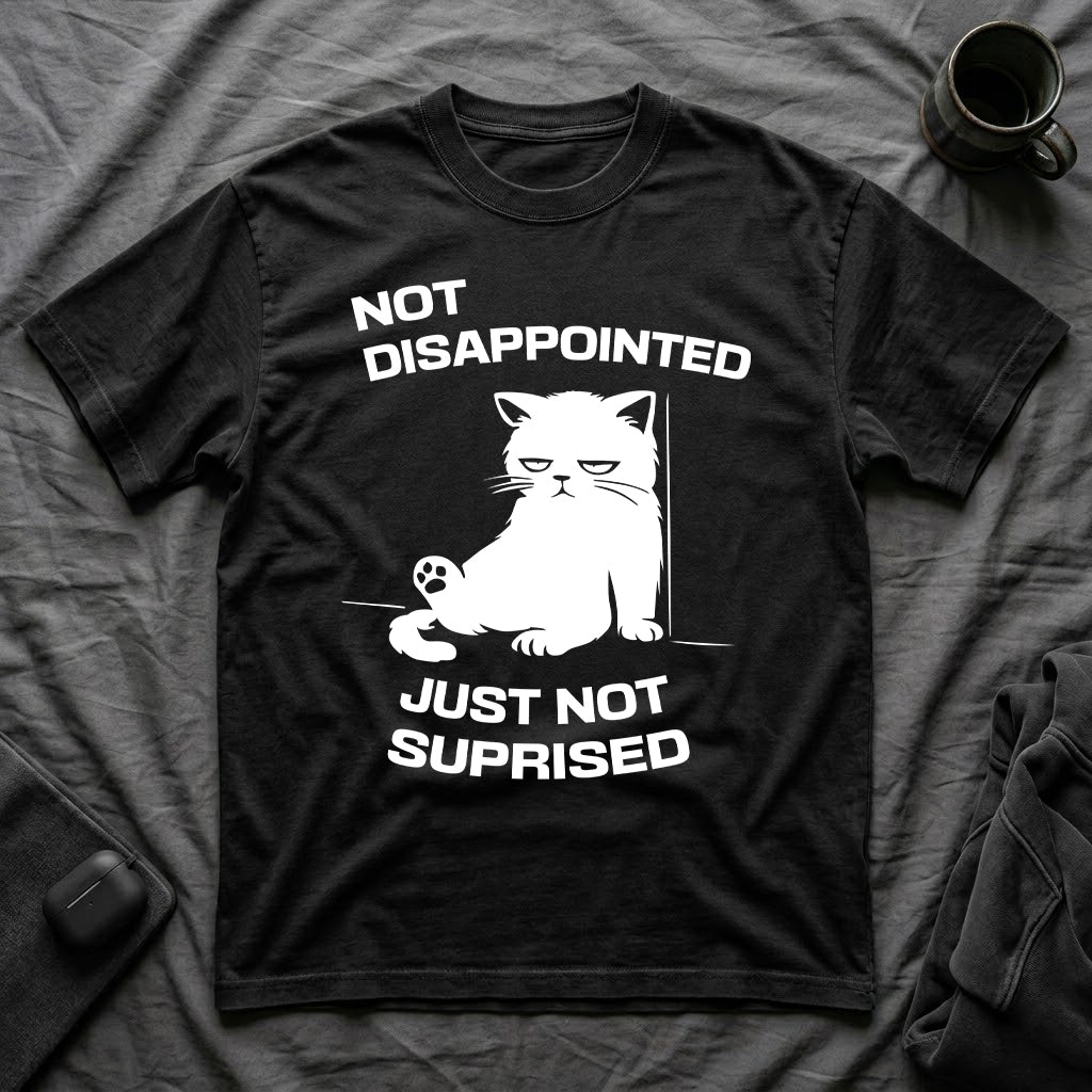 T-Shirt — 'Not Disappointed Just Not Surprised' Tired Cat Graphic Tee (Tired jokes)