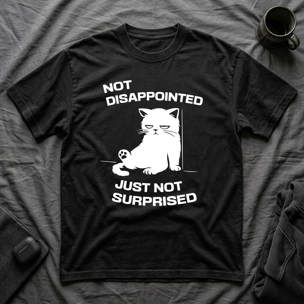 T-Shirt — 'Not Disappointed Just Not Surprised' Tired Cat Graphic Tee (Tired jokes)
