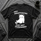 T-Shirt — 'Not Disappointed Just Not Surprised' Tired Cat Graphic Tee (Tired jokes)