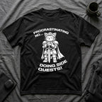 T-Shirt — 'PROCRASTINATING NO...DOING SIDE QUESTS!' Tired Cat Graphic Tee (Tired jokes)