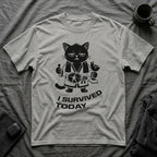 T-Shirt — 'I SURVIVED TODAY' Tired Cat Graphic Tee (Tired jokes)