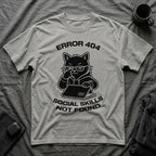 T-Shirt — 'ERROR 404 SOCIAL SKILLS NOT FOUND' Tired Cat Graphic Tee (Tired jokes)
