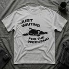 T-Shirt — 'JUST WAITING FOR THE WEEKEND' Tired Cat Graphic Tee (Tired jokes)