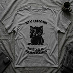 T-Shirt — 'My Brain Needs a Manager' Tired Cat Graphic Tee (Tired jokes)