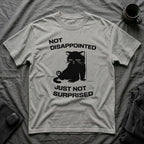 T-Shirt — 'Not Disappointed Just Not Surprised' Tired Cat Graphic Tee (Tired jokes)