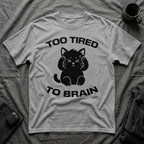 T-Shirt — 'Too Tired To Brain' Tired Cat Graphic Tee (Tired jokes)