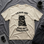 T-Shirt — 'LEAVE ME AND MY SNACKS' Tired Cat Graphic Tee (Tired jokes)