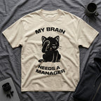 T-Shirt — 'My Brain Needs a Manager' Tired Cat Graphic Tee (Tired jokes)