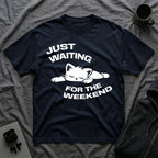 T-Shirt — 'JUST WAITING FOR THE WEEKEND' Tired Cat Graphic Tee (Tired jokes)