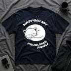 T-Shirt — 'NAPPING MY PROBLEMS AWAY' Tired Cat Graphic Tee (Tired jokes)