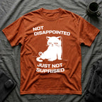 T-Shirt — 'Not Disappointed Just Not Surprised' Tired Cat Graphic Tee (Tired jokes)