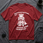 T-Shirt — 'PROCRASTINATING NO...DOING SIDE QUESTS!' Tired Cat Graphic Tee (Tired jokes)