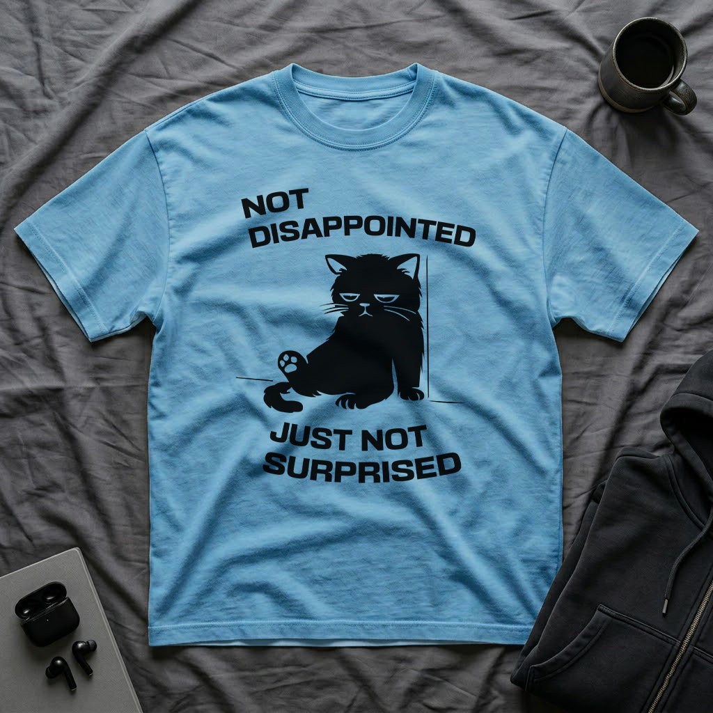T-Shirt — 'Not Disappointed Just Not Surprised' Tired Cat Graphic Tee (Tired jokes)