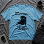 T-Shirt — 'Not Disappointed Just Not Surprised' Tired Cat Graphic Tee (Tired jokes)