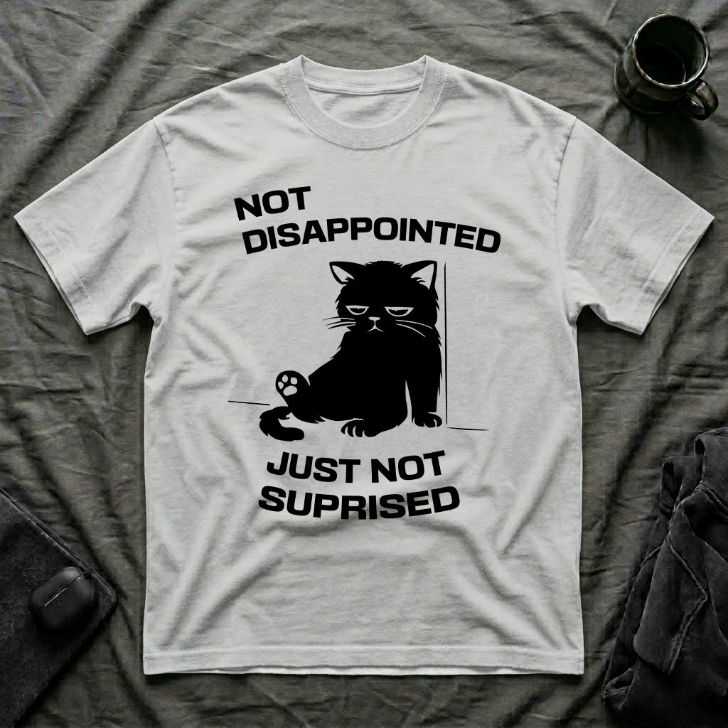 T-Shirt — 'Not Disappointed Just Not Surprised' Tired Cat Graphic Tee (Tired jokes)