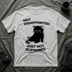 T-Shirt — 'Not Disappointed Just Not Surprised' Tired Cat Graphic Tee (Tired jokes)